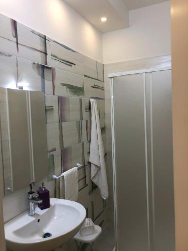 a bathroom with a sink and a shower at Pompei Art in Scafati