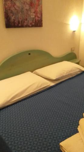 Postel nebo postele na pokoji v ubytování Agriturismo Funtan'Arva
