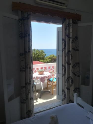 Ένα ή περισσότερα κρεβάτια σε δωμάτιο στο Massouri Rooms