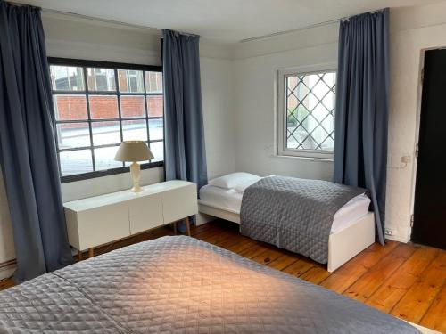 a bedroom with two beds and a window at Apartment Factory in Hamburg