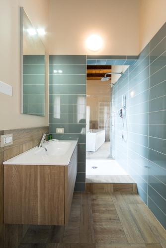 a bathroom with a sink and a shower at Agriturismo La Galizia in Cuggiono