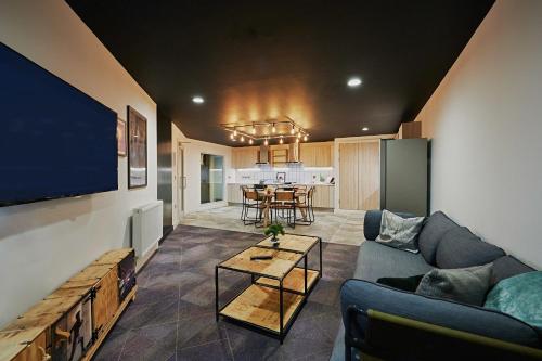 a living room with a couch and a table at For Students Only Modern studios in Glasgow West End in Glasgow