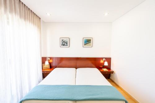 Säng eller sängar i ett rum på Apartamento Mar & Sol