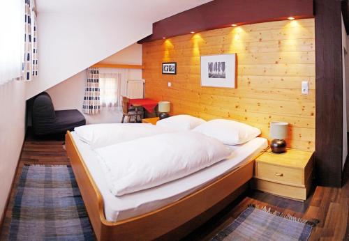 Ένα ή περισσότερα κρεβάτια σε δωμάτιο στο Ferienwohnungen Kirchweger