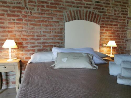 Postel nebo postele na pokoji v ubytování Agriturismo Airale