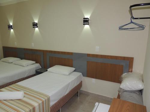 Katil atau katil-katil dalam bilik di Perola Verde Hotel