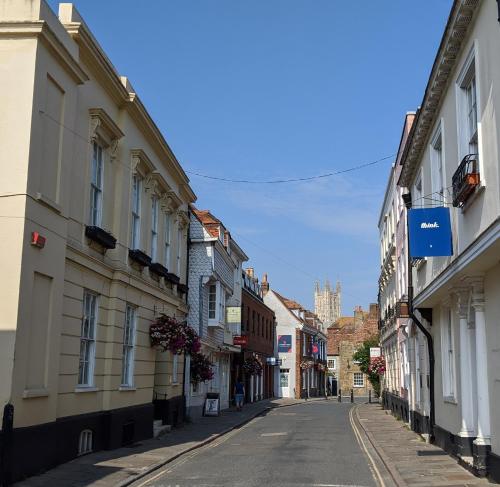 an empty street in a town with buildings at Number 8 in Canterbury