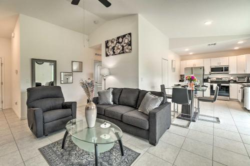 a living room with a couch and a table at Sunny Abode Less Than 1 Mi to Peace River Preserve! in Port Charlotte