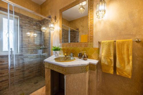 a bathroom with a sink and a shower at Villa Oasis Galé - Luxury Villa with private pool, AC, free wifi, 5 min from the beach in Albufeira