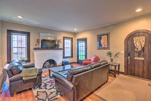 a living room with leather furniture and a fireplace at Cozy Birmingham Abode Less Than 7 Mi to Downtown Fun! in Birmingham