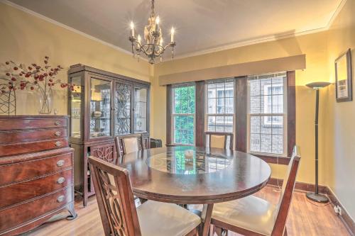 a dining room with a table and chairs and windows at Cozy Birmingham Abode Less Than 7 Mi to Downtown Fun! in Birmingham