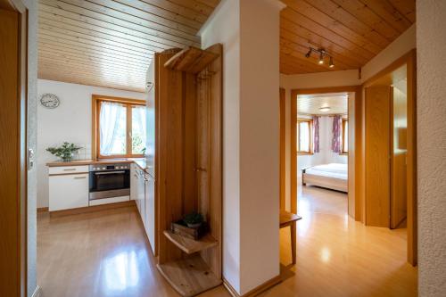 a room with a kitchen and a living room at Ferienbauernhof Oberhauser in Schoppernau