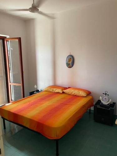 a bedroom with a large bed in a room at Villa del Sole in Terracina