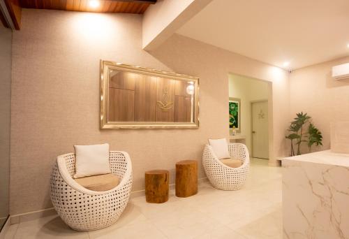 A seating area at Hotel Mandalas House by DOT Boutique