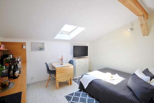 Telewizja i/lub zestaw kina domowego w obiekcie Plaża Apartament