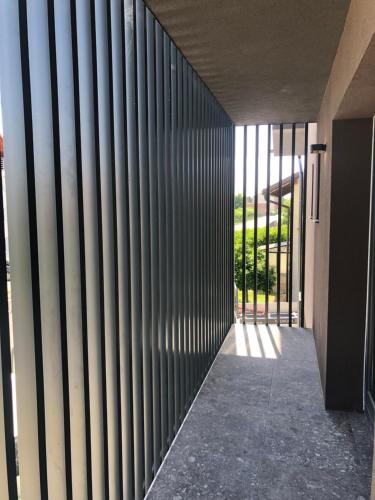 a hallway of a building with vertical metal bars at Boutique & Wellness Hotel Vital in Moravske Toplice