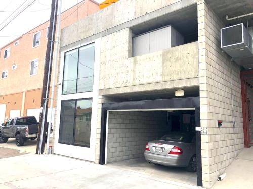 a parking garage with a car parked in it at Modern 2 Bdrm w/Parking in the Heart of Hillcrest in San Diego