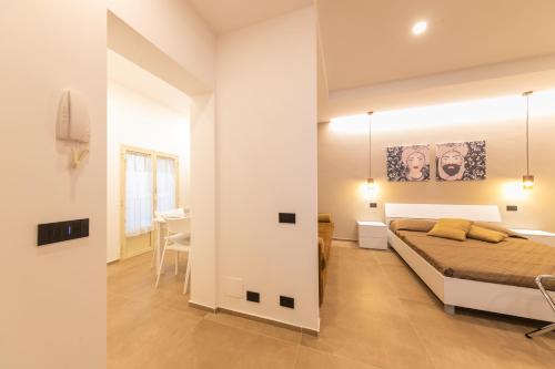 Ένα ή περισσότερα κρεβάτια σε δωμάτιο στο I Mori Apartments
