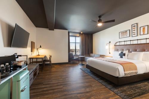 a hotel room with a bed and a television at Origin Westminster a Wyndham Hotel in Westminster