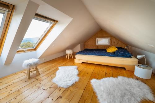 a bedroom with a bed in a attic at APARTMA VESTER in Bled