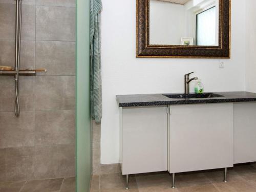 a bathroom with a sink and a shower at 5 star holiday home in Knebel in Knebel