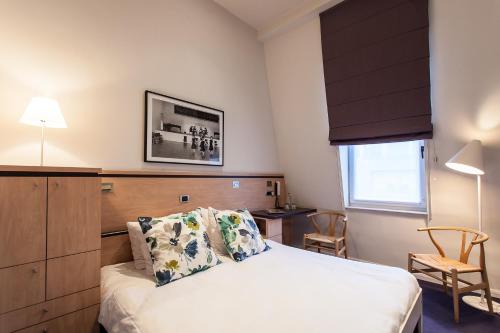 Postel nebo postele na pokoji v ubytování Hotel Van Bunnen