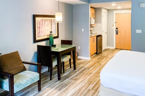 a room with a bed and a table and a chair at Elation #5111 in Destin