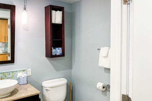 a bathroom with a white toilet and a sink at Elation #5111 in Destin