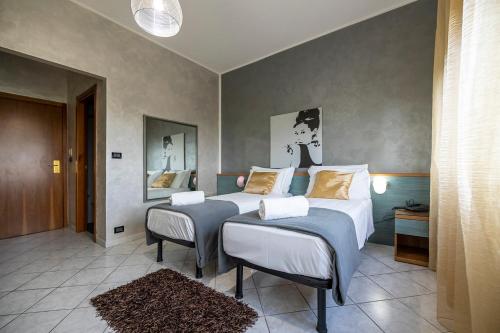 Postel nebo postele na pokoji v ubytování Piccolo Hotel Allamano