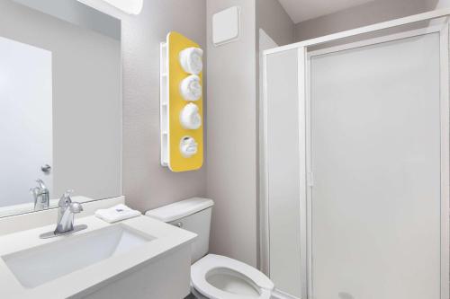 a bathroom with a toilet and a sink and a shower at Motel 6-Woodland, CA Sacramento Airport in Woodland