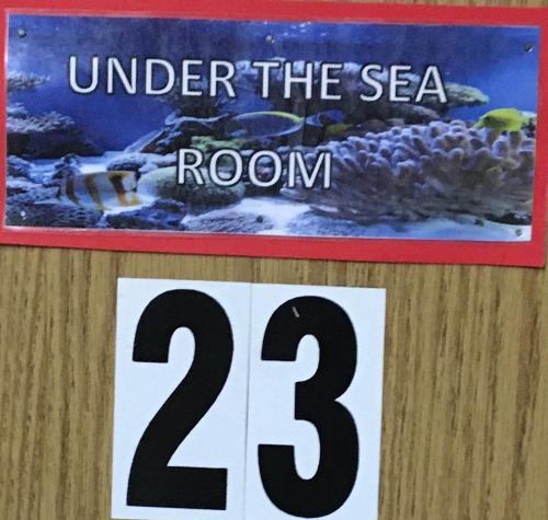 a sign that reads under the sea at Sunset View Inn L.L.C in Alamo