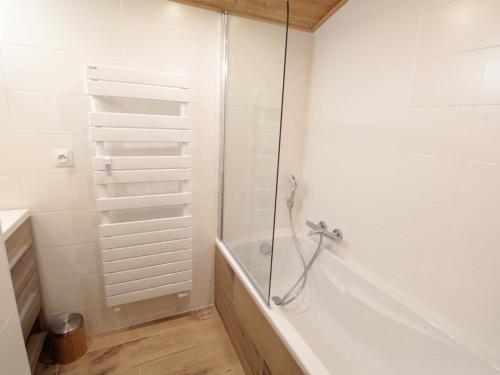 a bathroom with a shower and a bath tub at Appartement Les Carroz d'Arâches, 3 pièces, 8 personnes - FR-1-572-168 in Les Carroz d'Araches
