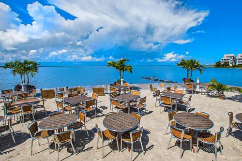 a group of tables and chairs on the beach at Sunset Island - 14 Shore Point in Ocean City