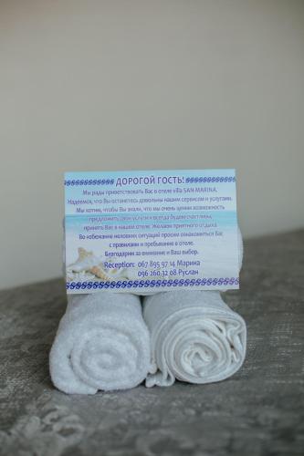 a roll of toilet paper sitting on top of a towel at Villa San-Marina in Zatoka
