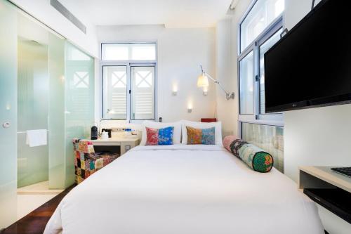 Postelja oz. postelje v sobi nastanitve The Daulat by Hotel Calmo