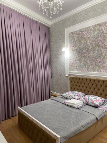 Ένα ή περισσότερα κρεβάτια σε δωμάτιο στο Гостиница АСКАР