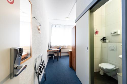 Koupelna v ubytování Budget Motel Self Check-In