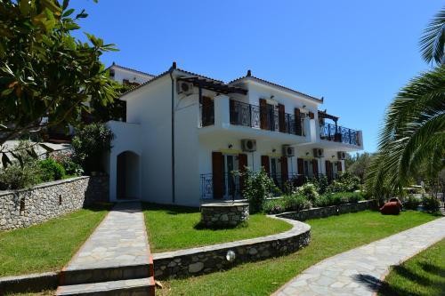 a villa with a garden in front of it at SKIATHOS-FILOKALIA in Achladies