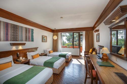 Postel nebo postele na pokoji v ubytování Club Himalaya, by ACE Hotels