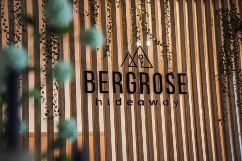 a bergrose intelligenceagency sign on a wooden wall at Bergrose Hideaway in Strobl