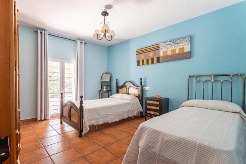 Кровать или кровати в номере Cortijo Rural Puerto Nuevo