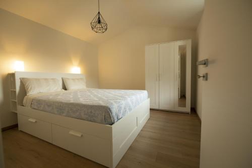 Säng eller sängar i ett rum på Ponte Vecchio - Grazioso nido in Vallecamonica