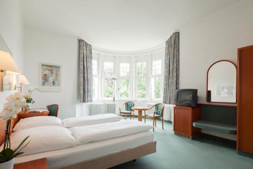 Кровать или кровати в номере Hotel Der Achtermann