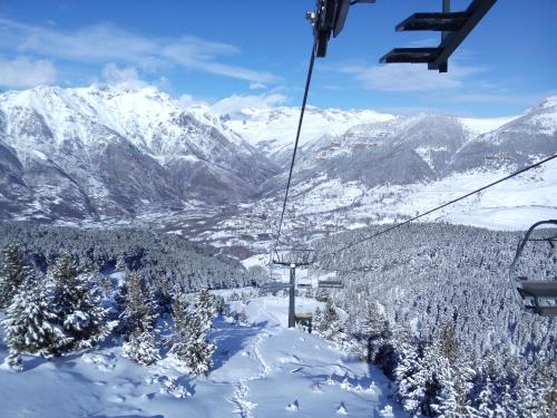 a ski lift going up a snow covered mountain at Casa Rural Borda Marianet in Cerler