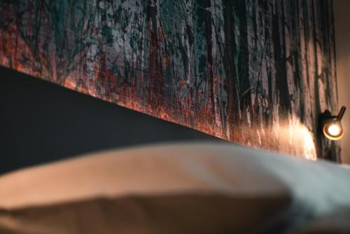 a close up of a painting on a wall at CHICLIVING Appartements in St. Wolfgang