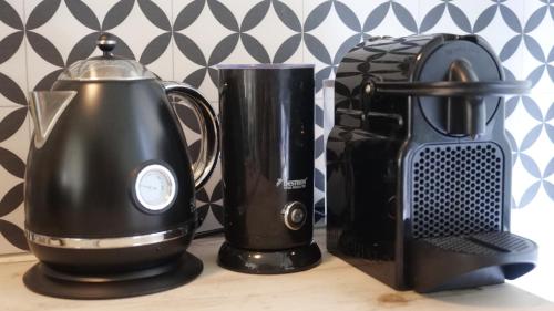 a blender and a toaster sitting on a counter at Houseboat apartment with water terrace, free bikes & fast wifi in Amsterdam