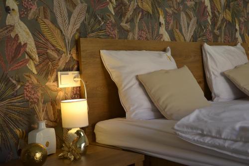 a bedroom with two beds and a lamp on a table at Apartmany u Polanských Lednice in Lednice