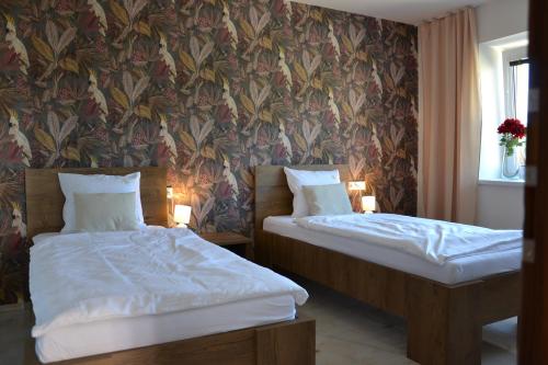 מיטה או מיטות בחדר ב-Apartmany u Polanských Lednice