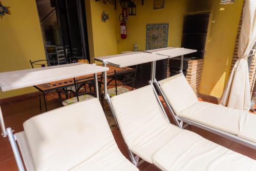 a group of tables and chairs in a room at ToviMar Apartments in Taormina