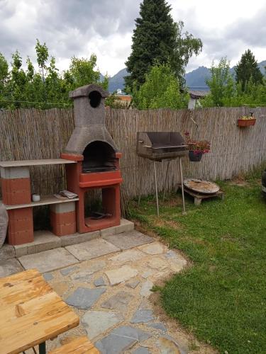 a outdoor oven and a grill in a backyard at Vysoké Tatry Gerlaška in Gerlachov